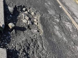 Supporting image for story: Demand for massive pothole to be fixed - council says it's not responsible for it