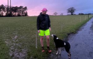 Josh Moreton with his dog after a training run
