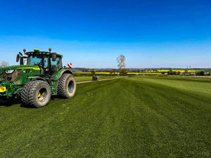 Turf field being prepared for harvesting