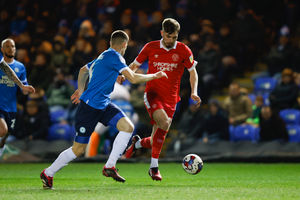 Tom Bloxham of Shrewsbury Town and Ronnie Edwards of Peterborough United (AMA)