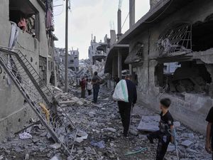Palestinians inspect the rubble of homes destroyed by Israeli airstrikes in Jabaliya, northern Gaza Strip