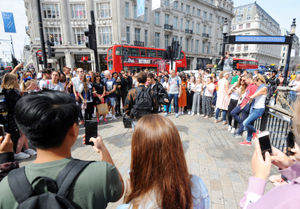 One Direction star Liam Payne performing with Zedd outside Oxford Circus underground station in London