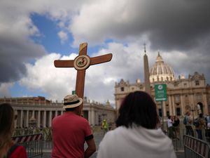 Crowds watch for smoke signals from the Sistine Chapel