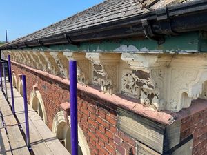 Some of the damaged corbels on the building