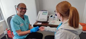 Finger prick diabetes check.