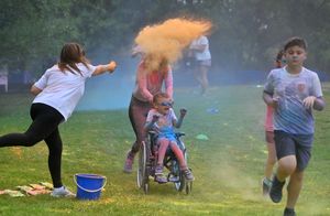 Much Wenlock Primary School's colour run. Pictured
(centre) is Penny Webster with Loki.