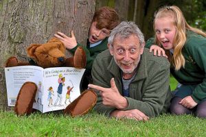 Children's author Michael Rosen at Priory School, Shrewsbury with pupils Oliver Sharp and Olivia Deane, both aged 11