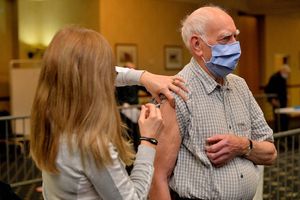 Peter Warrilow, 89, being given the jab