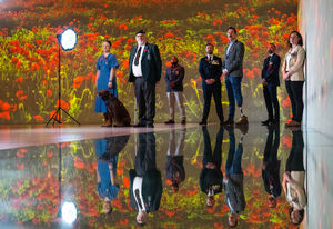 (Left to right) Veterans Bronwyn Wilkinson, Gavin Sherry, Nick Bennion, Jason Paul, Richard Davies, Steven Ford and Leanne Walmsley, in front of an immersive poppy landscape projection at the launch of the Royal British Legion Poppy Appeal 2025, at Frameless in central London.