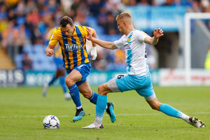 Shaun Whalley of Shrewsbury Town and Ben Hart of Burton Albion. (AMA)