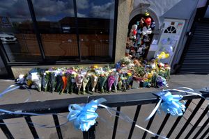 Blue ribbons and flowers left at the scene on Brownhills Hill Street where Ciaran Leigh Morris died after the pram he was in was hit by a car