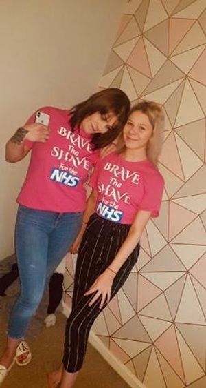 Claire and her daughter before the shave