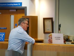 Prime Minister Sir Keir Starmer talks to staff during a visit to Rossendale Primary Health Care Centre in Lancashire