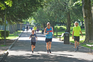 Joggers enjoy the hot weather at Walsall Arboretum.