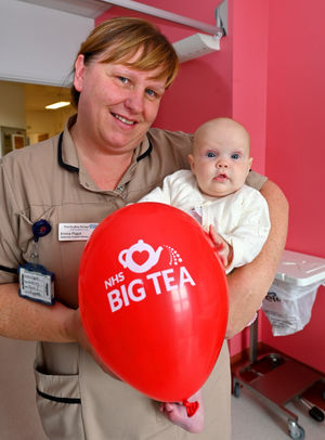 Emma Piggott helps baby Poppy celebrate the anniversary in the maternity ward