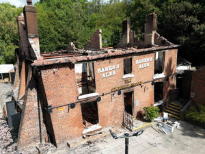 The burnt out remains of The Crooked House pub before it was demolished. Photo: Jacob King, PA