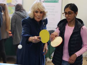 Supporting image for story: Queen shows off table tennis skills as King rues end to his skiing days