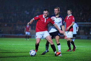 Under pressure - Kyle Brownhill closes down Sam Sheridan of FC United