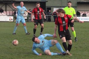 A Llandudno players hits the deck after a tackle