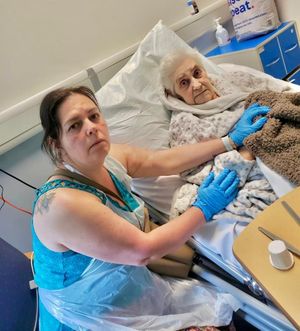 Valerie Sanderson being visited by her daughter, Sarah.