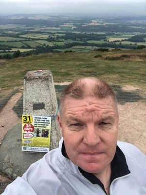 John at the top of the Wrekin during one of the 31 walks.