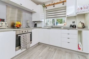 The kitchen is fully fitted, and enjoys plenty of light