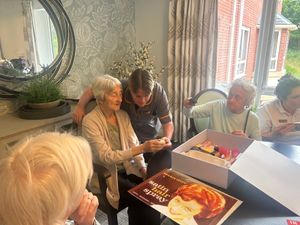 Residents at HC-One’s Priorslee House Care Home opening the Boots memory boxes
