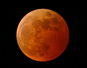 The Moon acquires a red glow as it falls in the Earth's shadow. Picture: NASA.