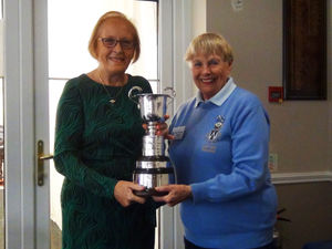 Shropshire Ladies County Golf Association (SLCGA) president Margaret Ratcliffe presents the Wynne Corrie Cup Caroline Sycamore