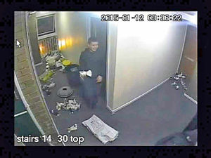 One of the gang appears to grin as he holds a bird