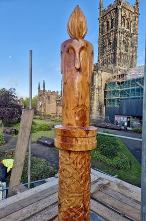 The sculpture reflects the motto of Wolverhampton "Out of darkness, cometh light"