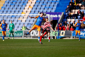 Shrewsbury Town’s Iwan Morgan challenges for a header