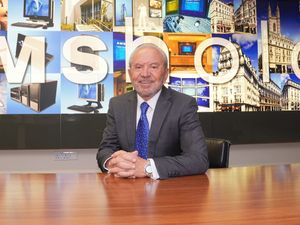 Lord Sugar in the boardroom of Amshold House in Loughton, Essex