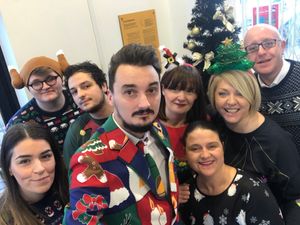 Wolves ticket office donning their festive jumpers for The Haven. Credit: Kerri Davies