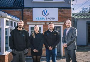 Versa Group staff alongside solicitor, Andy Ward, of Talbots Law