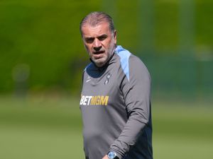 Spurs boss Ange Postecoglou looks on during training