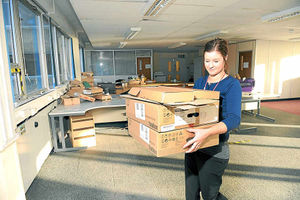 Nicole French, who is a revenue officer at the council, helps with packing