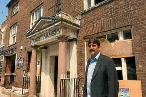 Businessman Maroof Shah outside the boarded-up Corbett Arms Inn, in Market Drayton,just before the Post Office moved in