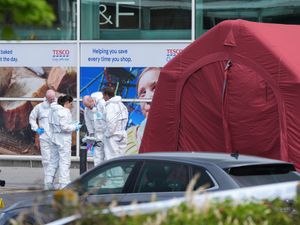 Supporting image for story: Man who died in supermarket shooting incident fired in the air as shoppers fled