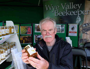 Bob North of Wye Valley Bee Keepers, with some of the honey they produce at their aviaries. Established in 1978 they encourage, improve and enhance bee keeping in the area by running a course during May each year. Image by Andy Compton