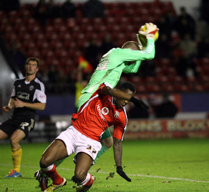 Mathieu Manset with Sheffield United's goalkeeoer Iain Turner