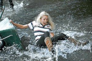 Making a splash  Alice Grimes takes a spill in the river as her wheelbarrow ran out of control during the race in Clun