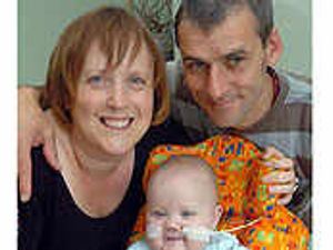 Supporting image for story: Parents' joy at Huw's milestone