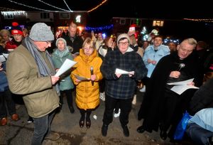  Father Ron and St Francis Choir members sing some Christmas songs.
