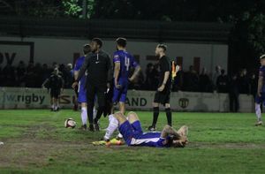 Chasetown players on the floor after their shoot-out defeat (Dave Birt)