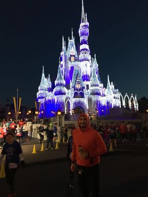 Nathan Judah running by the Magical Kingdom