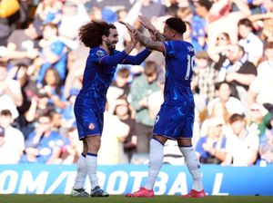 Chelsea’s Marc Cucurella celebrates scoring the opening goal with Jadon Sancho (right)