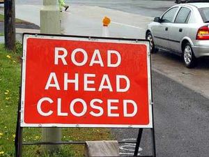 Supporting image for story: Road shut by flood as pipe bursts