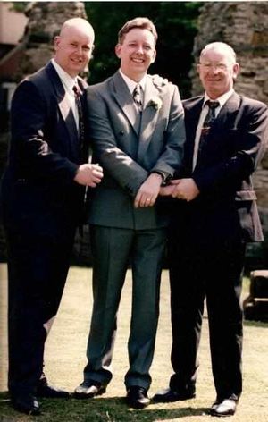 Wayne, centre, with brother Paul and father Michael in 1995
