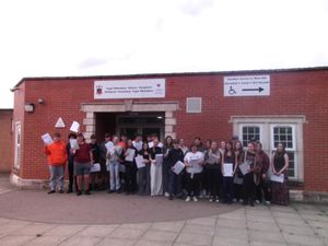 Group of successful pupils at front of school